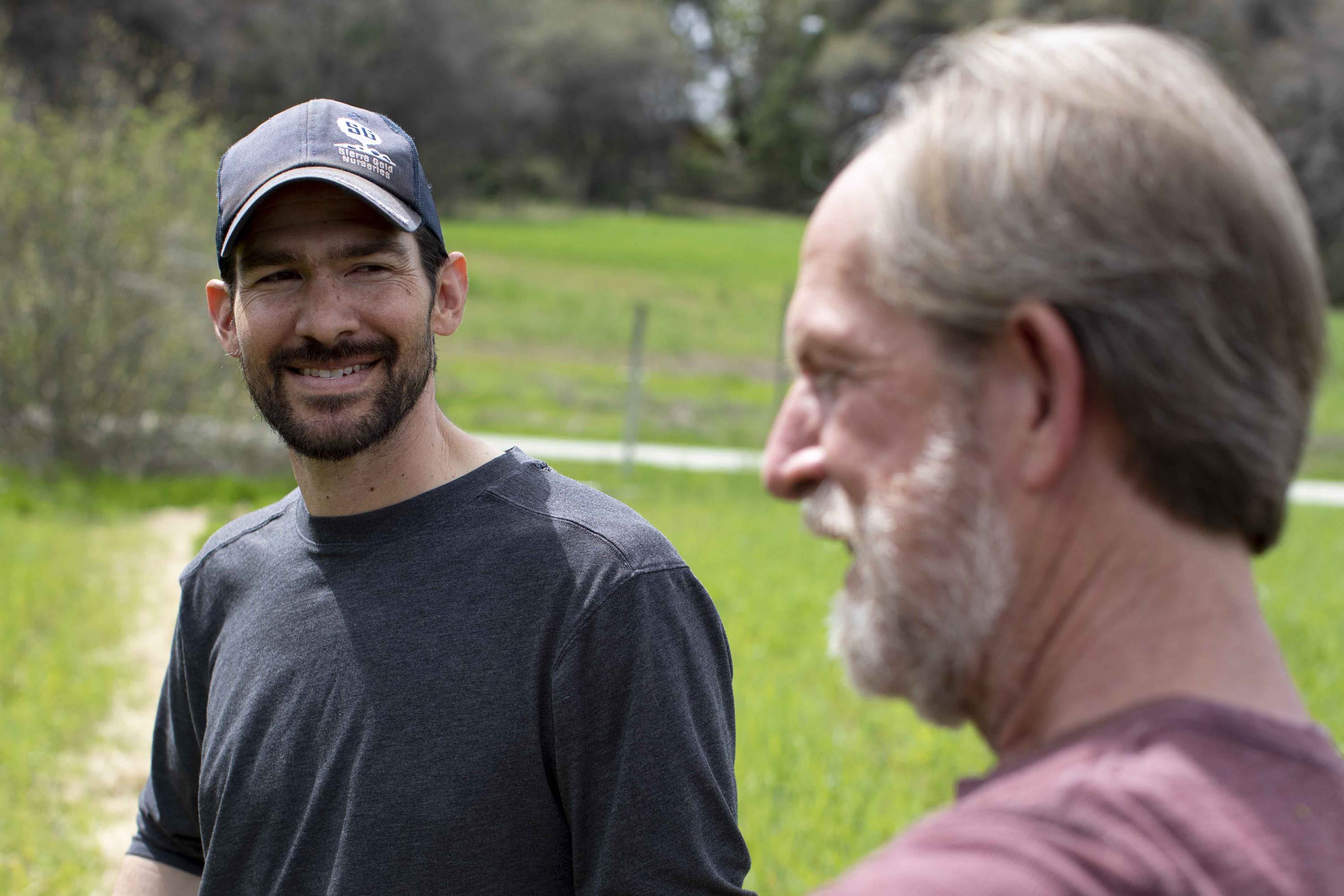 Alan Haight (pictured in red shirt) founded Riverhill Farm just outside Nevada City in 2001. In 2018, he and and his wife and farming partner, Jo McProud, handed farm operations to a younger farmer, Antonio Garza (pictured in dark gray shirt), in a lease agreement that allows Haight and McProud to retire and continue living on the farm. Garza’s partner, Daylin Wade (pictured in light gray shirt), works part time on the farm.