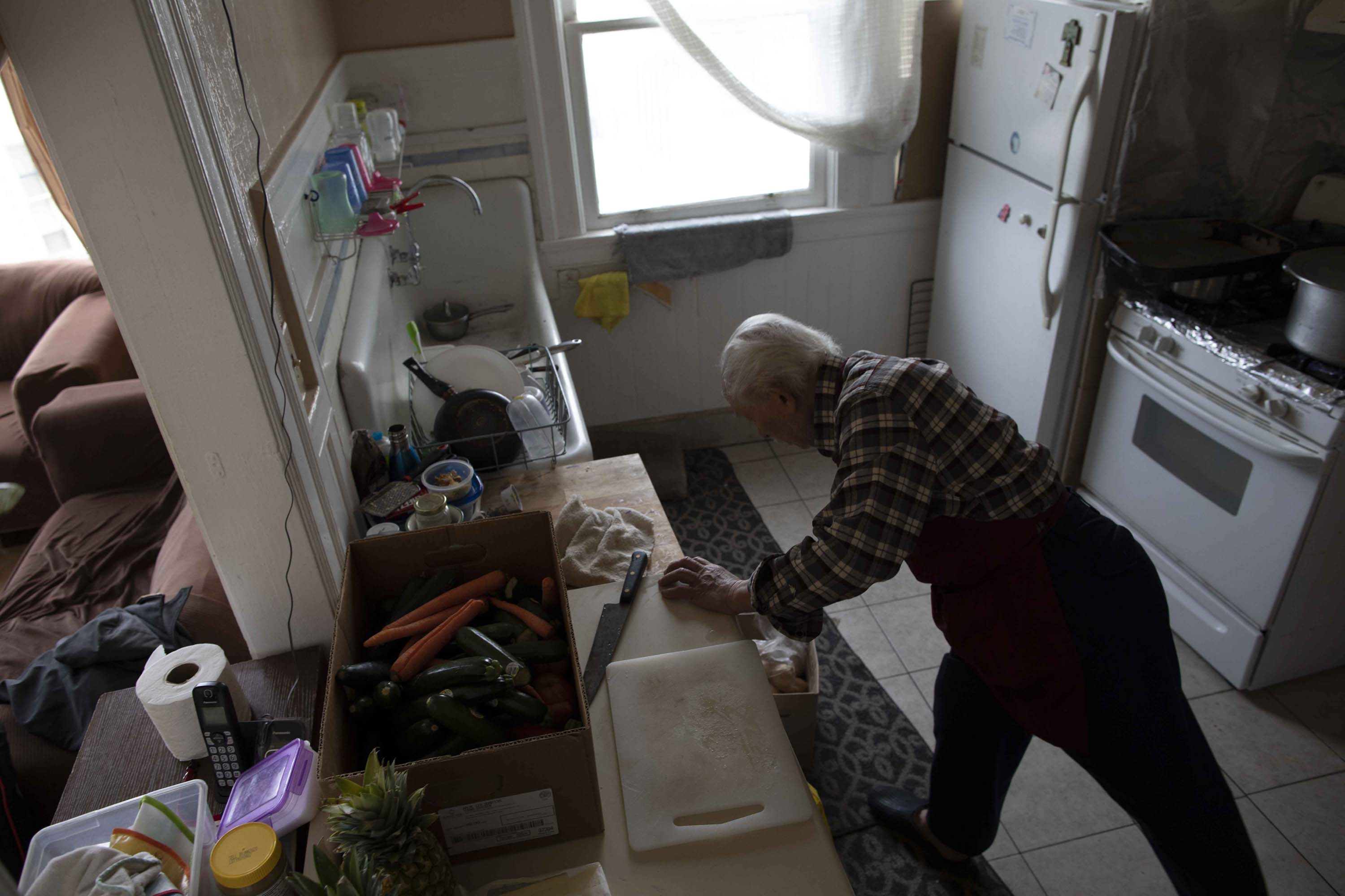 Emam Saber, 77, cooks at his San Francisco home. Saber, who is now retired, used to work as a chef at San Francisco hotels, including the St. Francis and Fairmont.